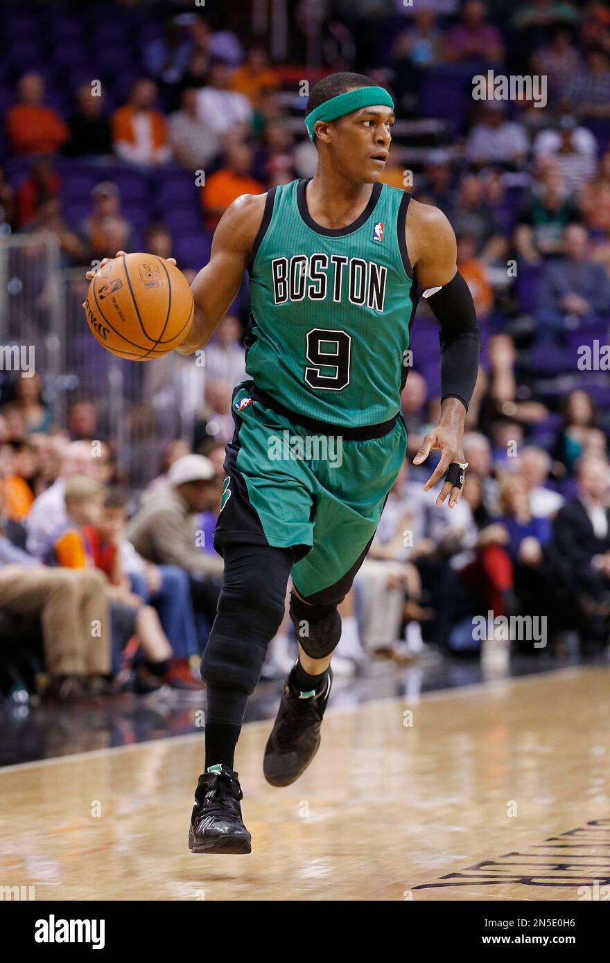 Boston Celtics' Rajon Rondo dribbles the ball against the Phoenix Suns ...