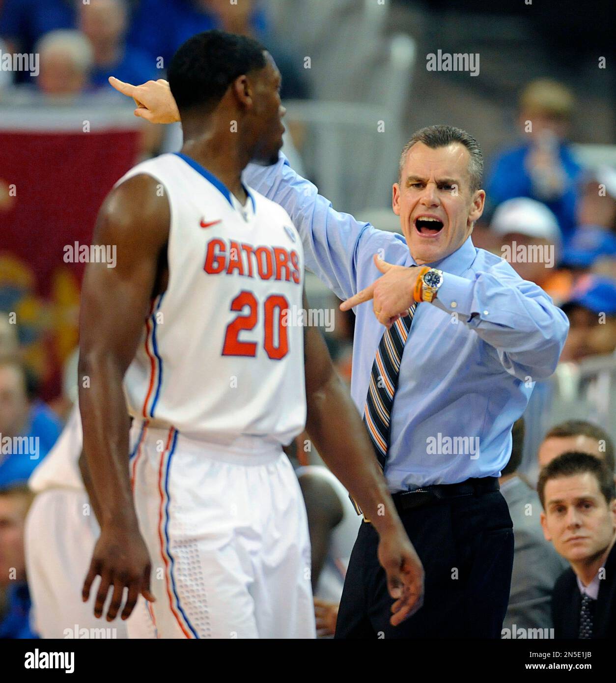 Florida guard Michael Frazier II (20) looks back at Florida coach Billy ...