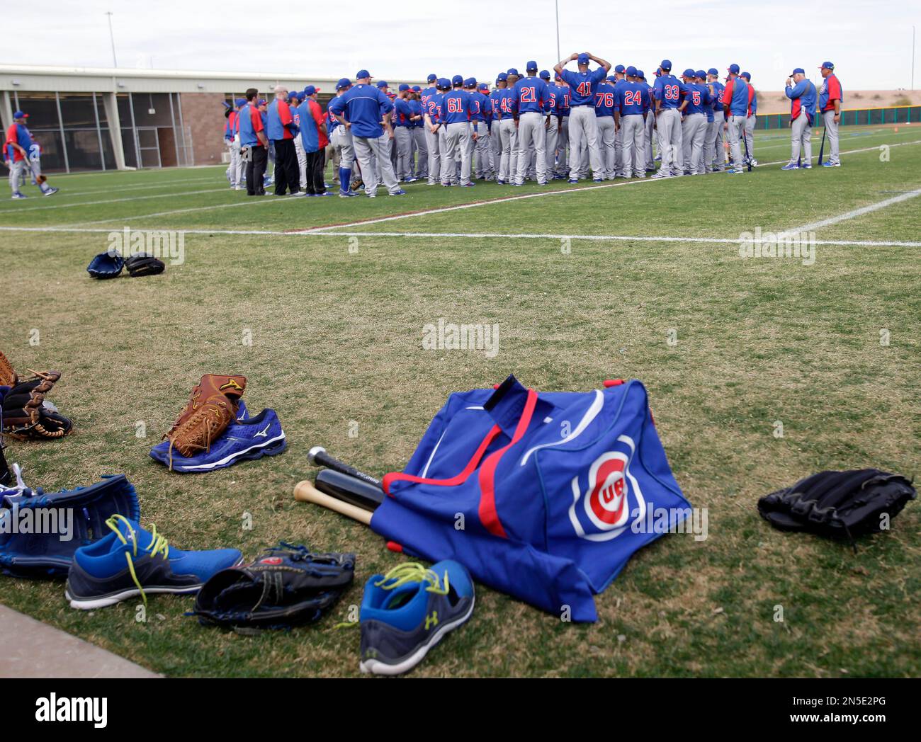 Chicago Cubs player meet during spring training baseball practice