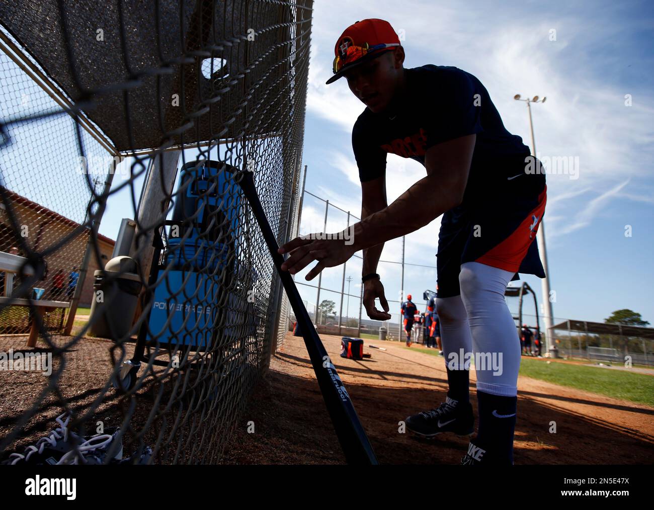 Houston Astros infielder Carlos Correa grabs his bat during a spring