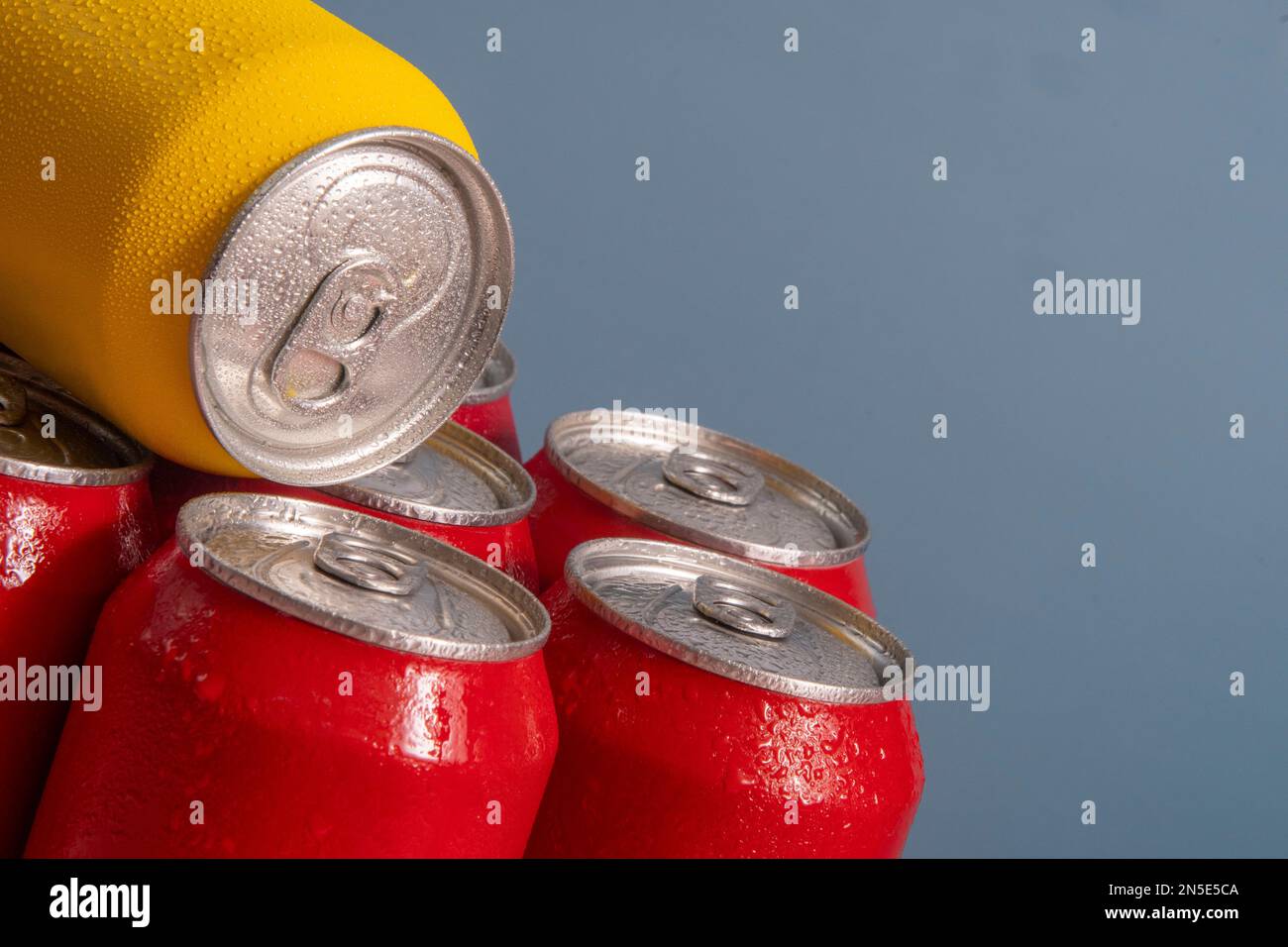 Group of aluminum soda cans, chilled, frozen and with water drops Stock