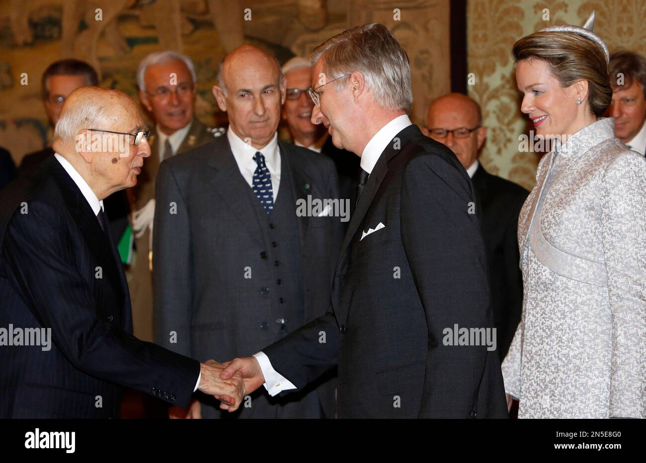 King Philippe of Belgium, center, flanked by Queen Mathilde, right ...