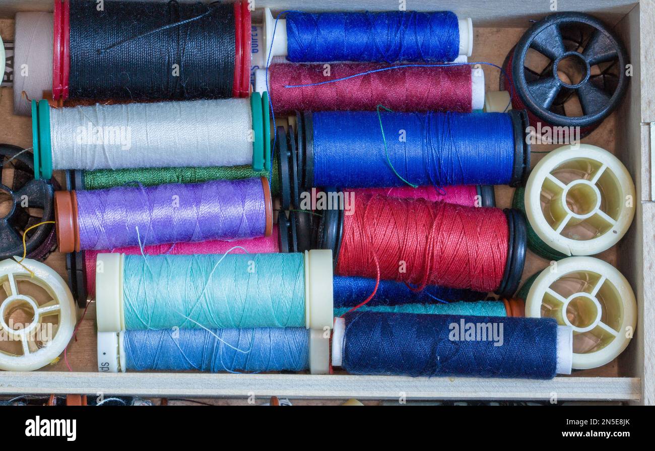Bulk spools of thread in sewing box Stock Photo Alamy