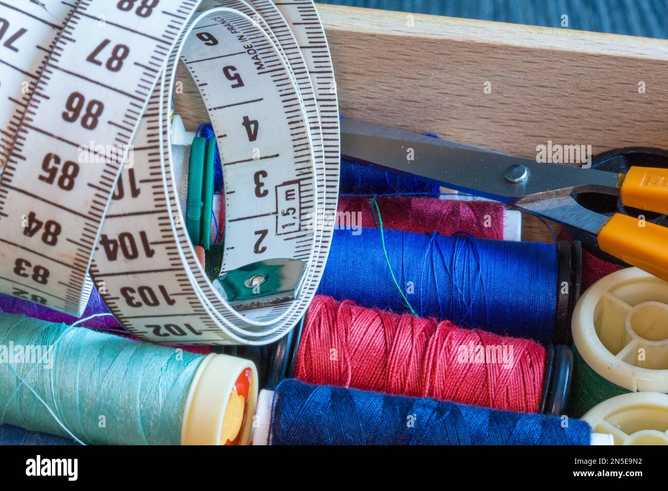 Bulk spools of thread in sewing box Stock Photo - Alamy