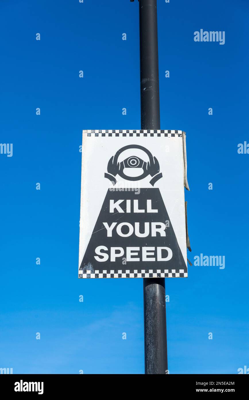 Black and white warning sign saying to car drivers 'kill your speed' Stock Photo