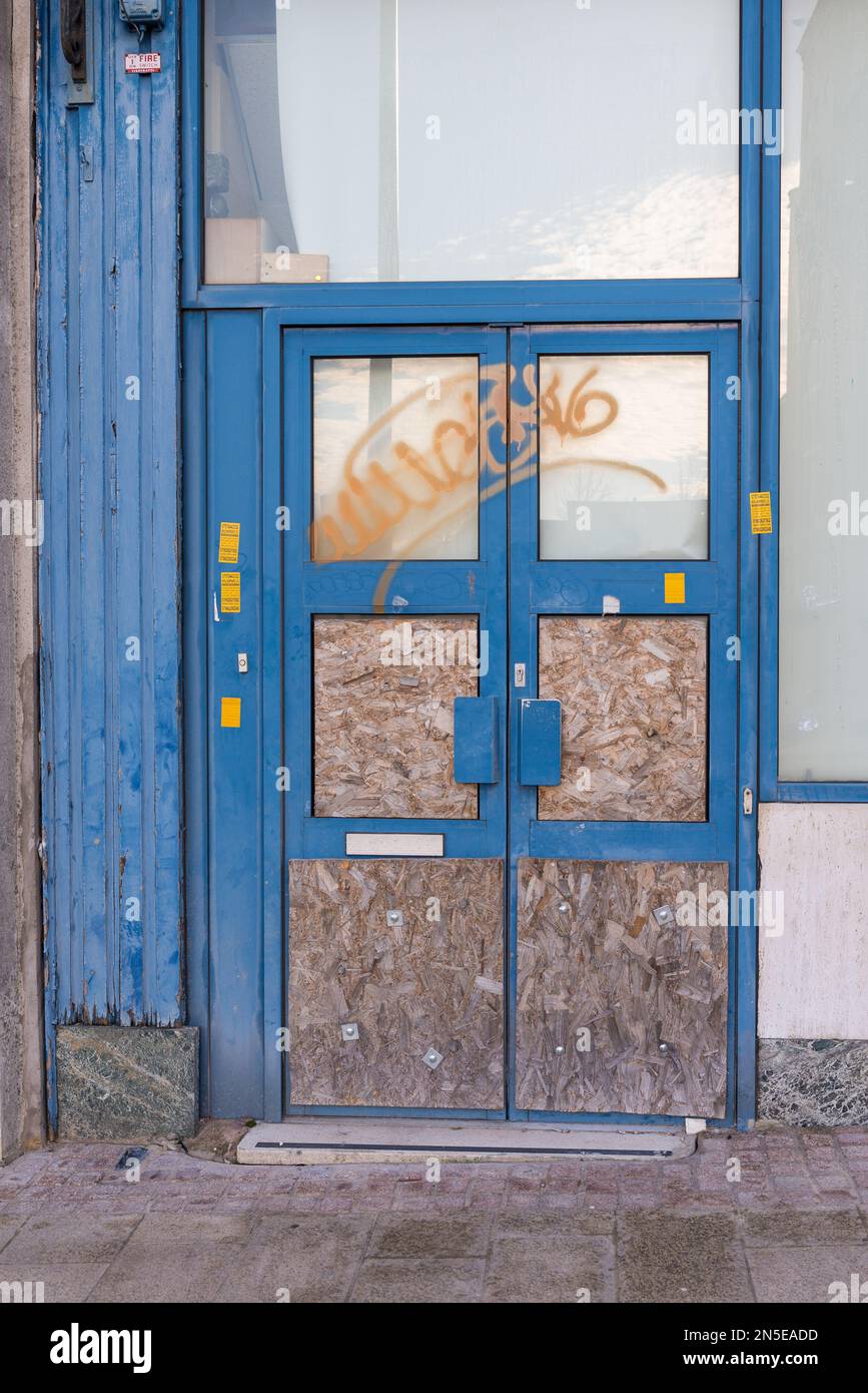 Boarded up door at entrance to building Stock Photo
