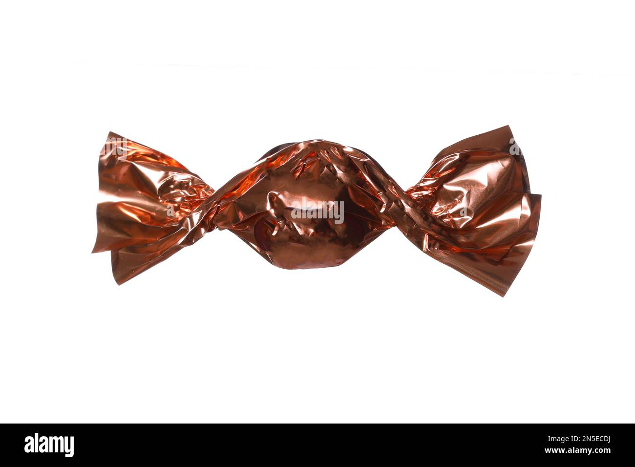 candy in a golden wrapper isolated on white background Stock Photo - Alamy