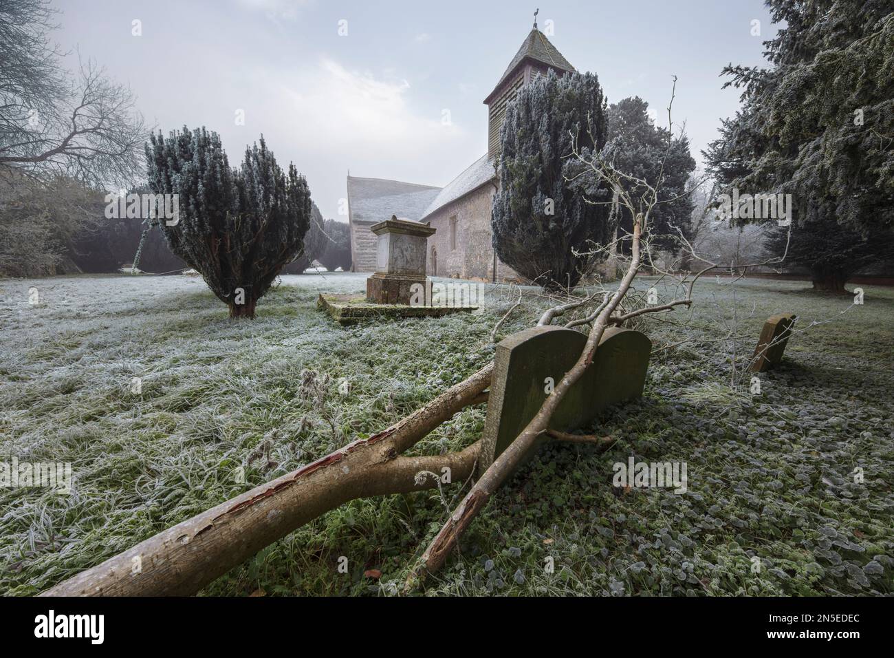 All Saints Church on a frosty winter morning with freezing fog clearing, Old Burghclere, Hampshire, England, United Kingdom, Europe Stock Photo