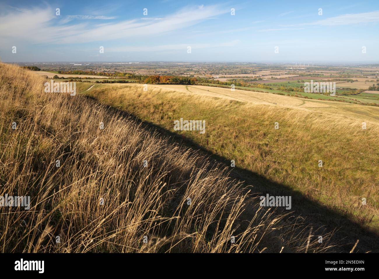 Ramp and ditch of the iron age hillfort of Uffington Castle with view of the Vale of the White Horse in background, near Wantage, Oxfordshire, England Stock Photo