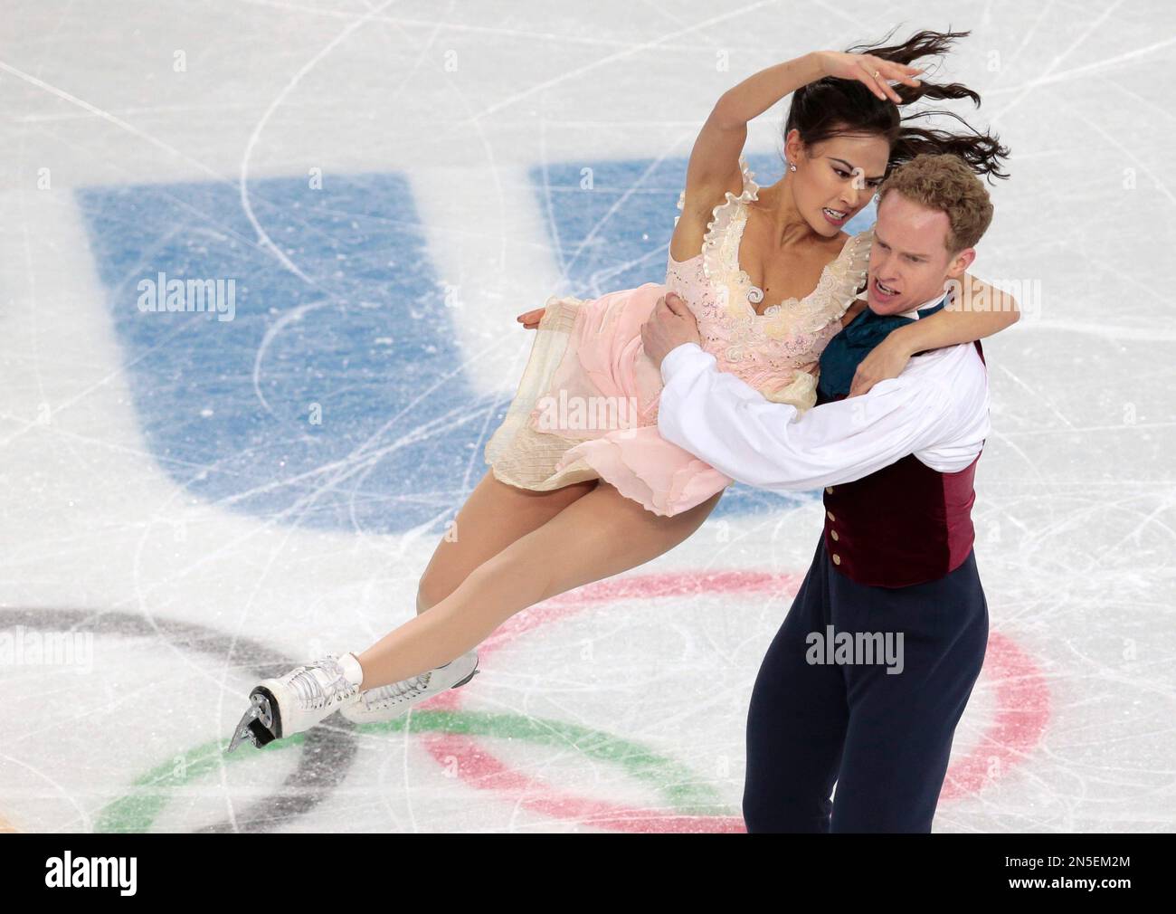 Madison Chock and Evan Bates of the United States compete in the ice
