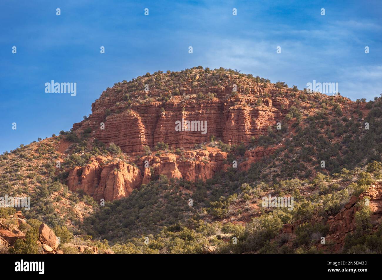 Rural Rocks Grand red rock mountain side in rural New Mexico on clear day Stock ...