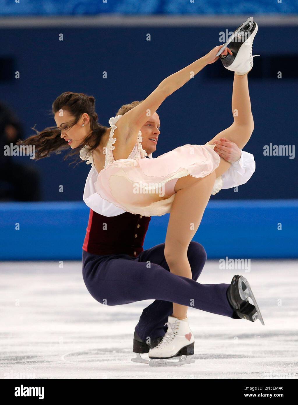 Madison Chock and Evan Bates of the United States compete in the ice