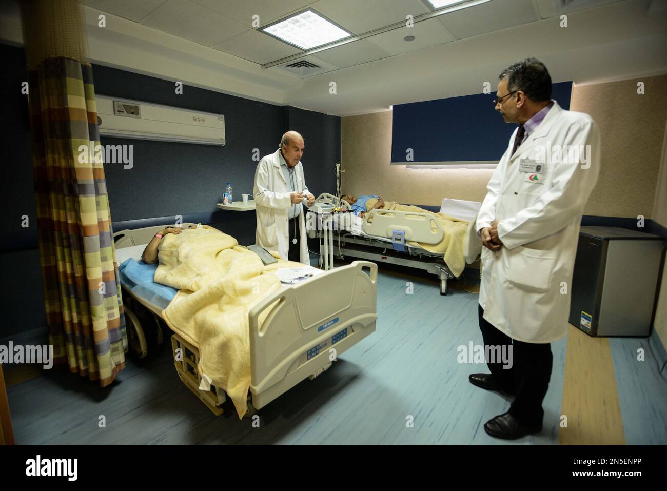 Egyptian doctors treat patients who were wounded in a deadly explosion ...