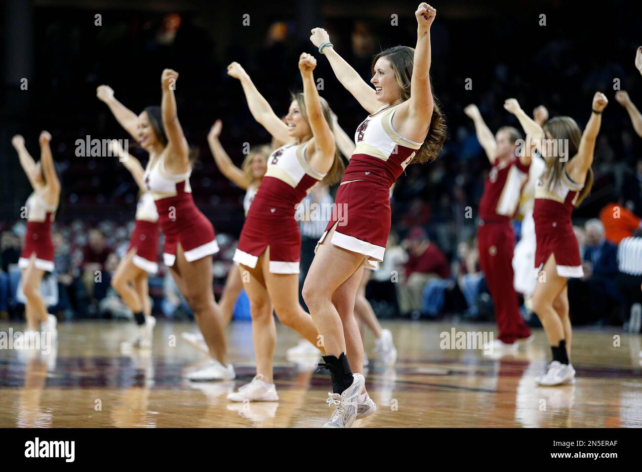 Boston College cheerleaders perform during an NCAA basketball game