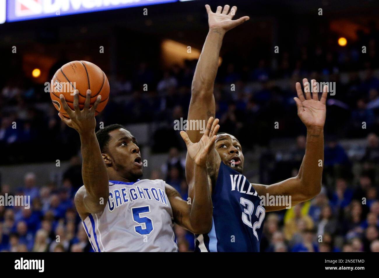 Creighton's Devin Brooks (5) shoots over Villanova's James Bell (32) in