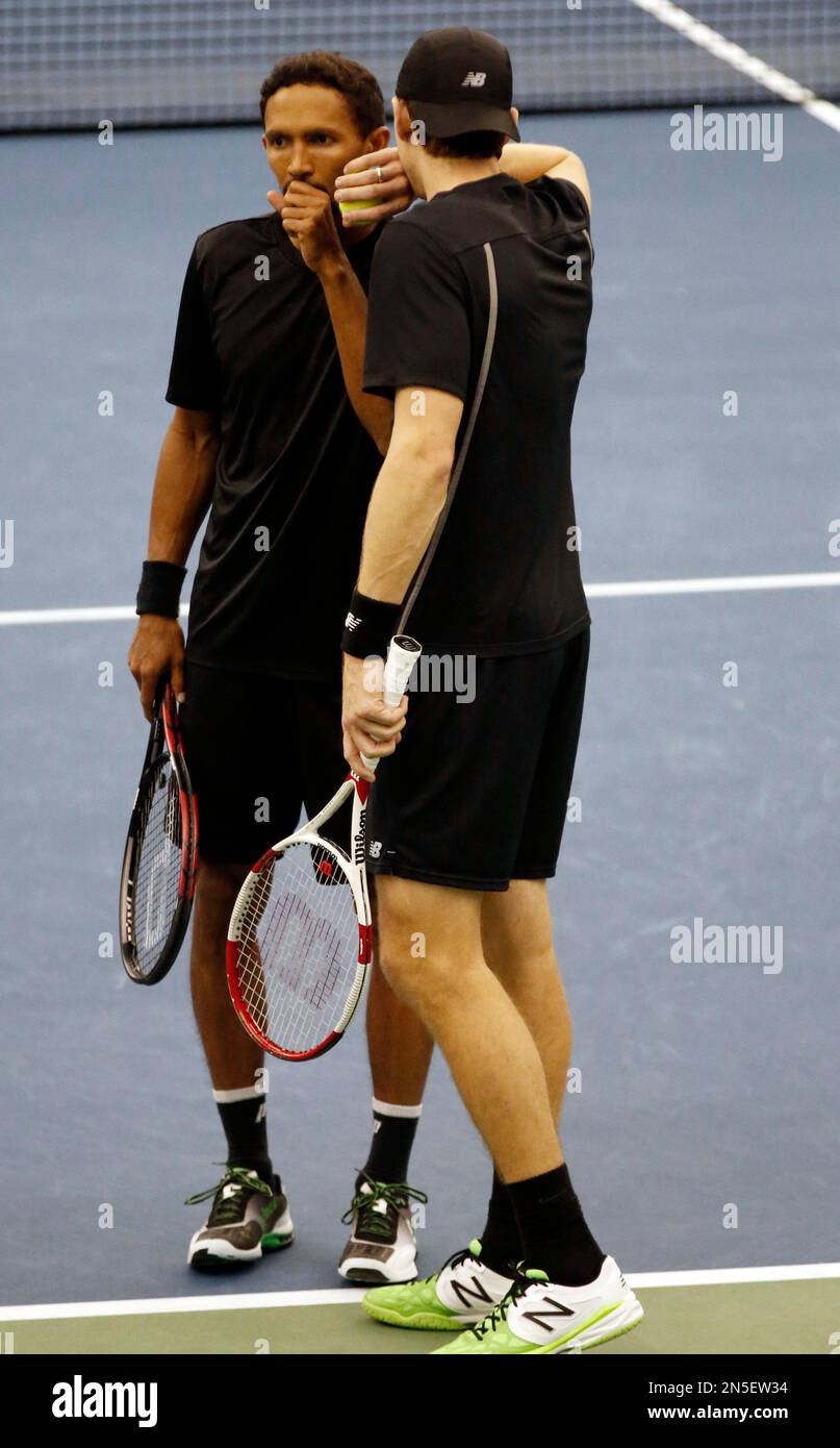 The doubles team of Raven Klaasen, left, of South Africa, and Eric Butorac  confer during the finals against Bob and Mike Bryan at the U.S. National  Indoor Tennis Championships, Sunday, Feb. 16,