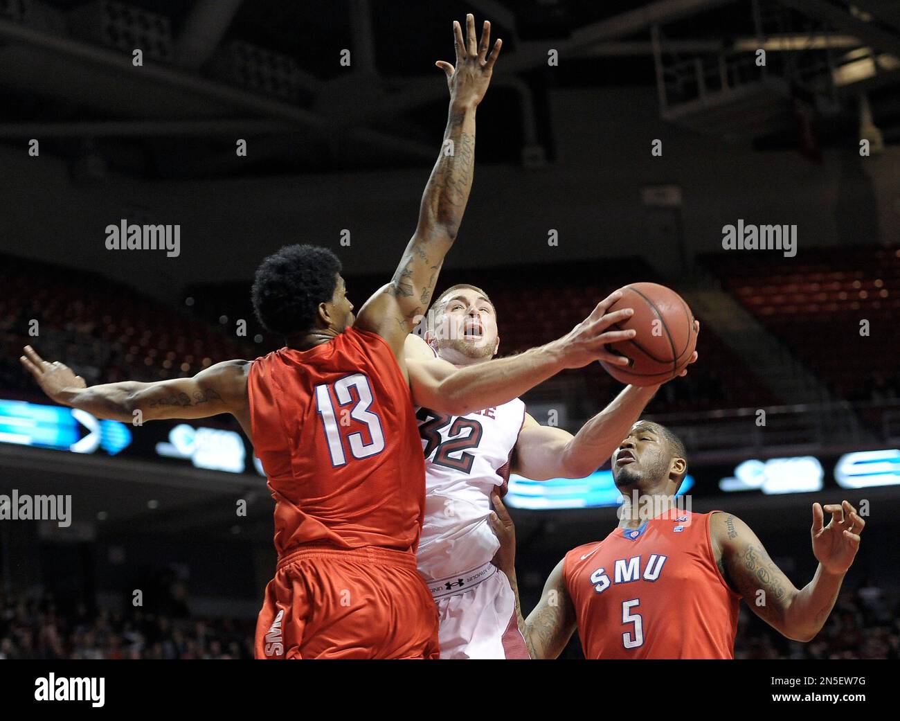 Temple's Dalton Pepper (32) drives past SMU's Crandall Head (13) and