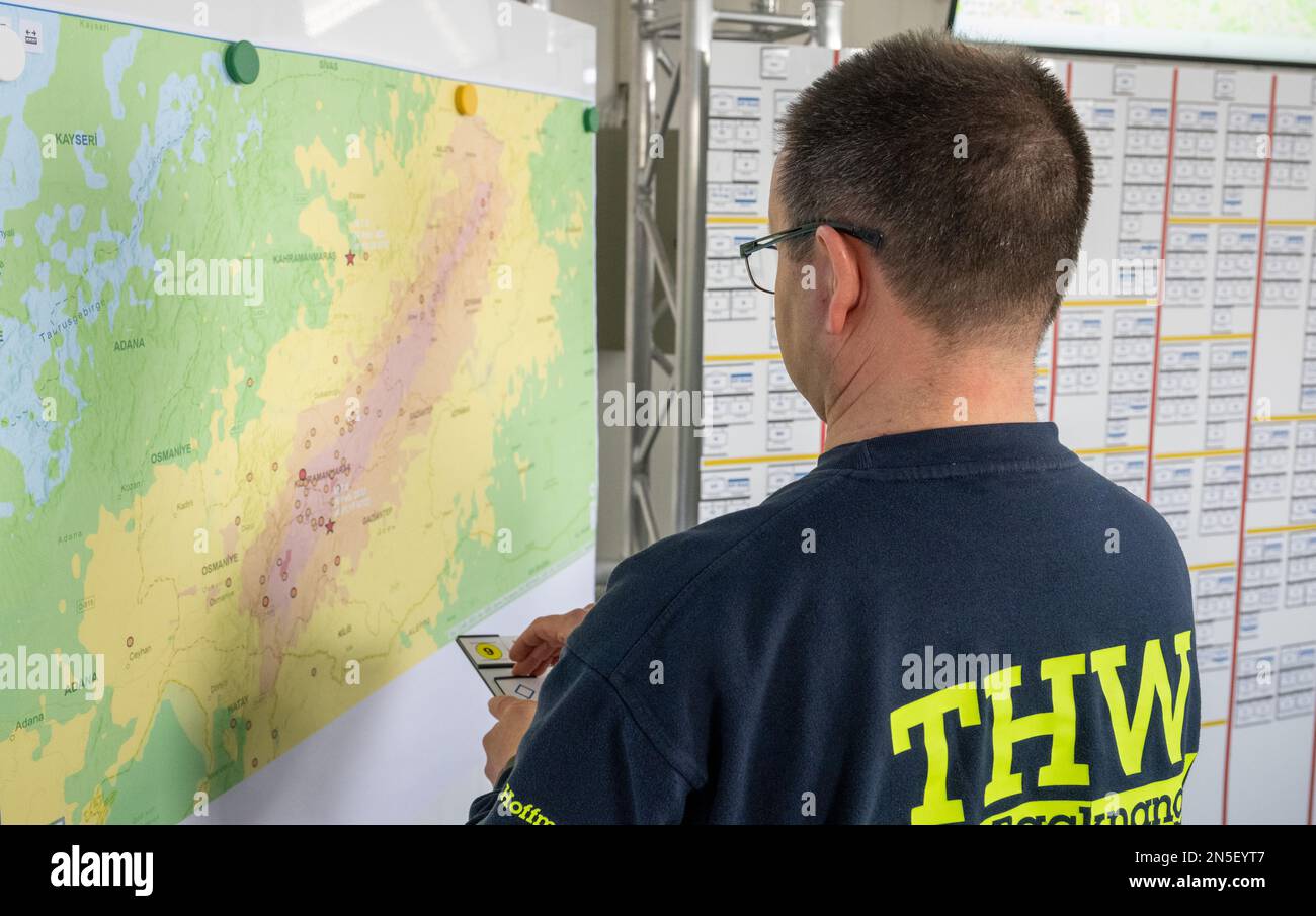 Ulm, Germany. 09th Feb, 2023. Coordinator Steffen Hoffmann stands in front of a map in the THW logistics center. Within the framework of the German government's earthquake aid, relief supplies for the disaster region Turkey/Syria are provided from here. Credit: Stefan Puchner/dpa/Alamy Live News Stock Photo