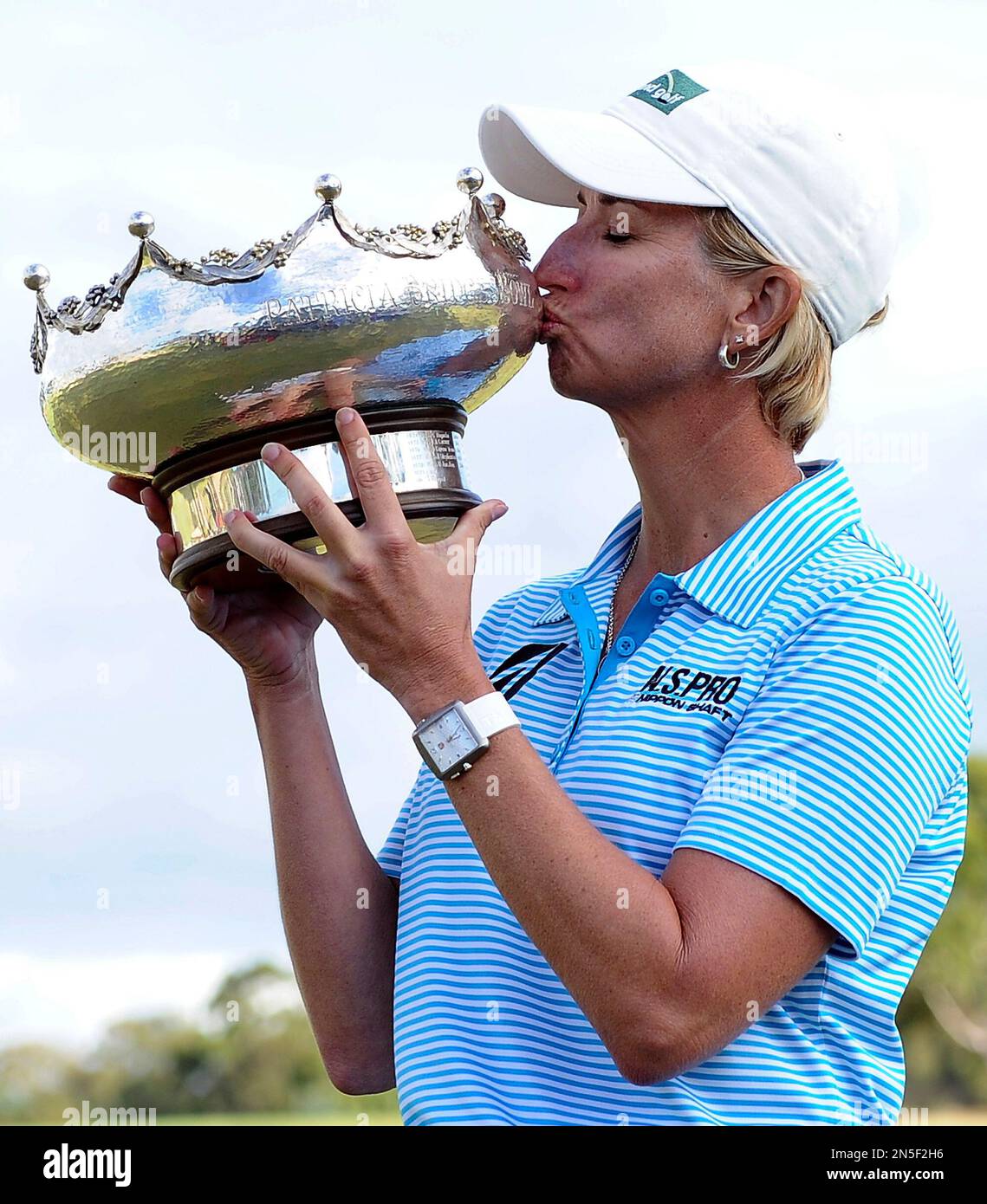 Karrie b of Australia kisses her winning trophy as she poses for