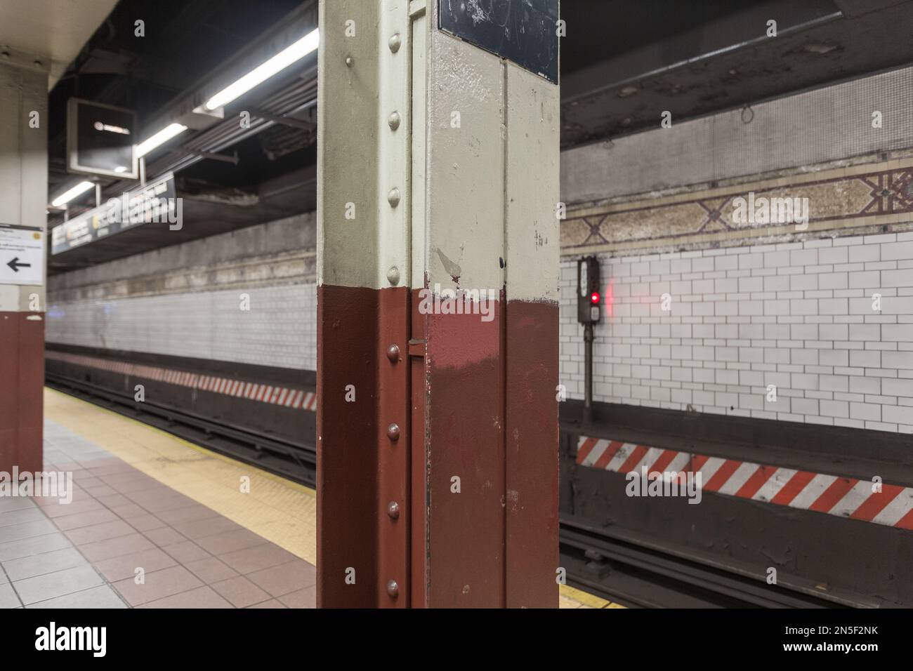 Close up of steel beam holding up ceiling in underground subway station in urban New York Stock Photo