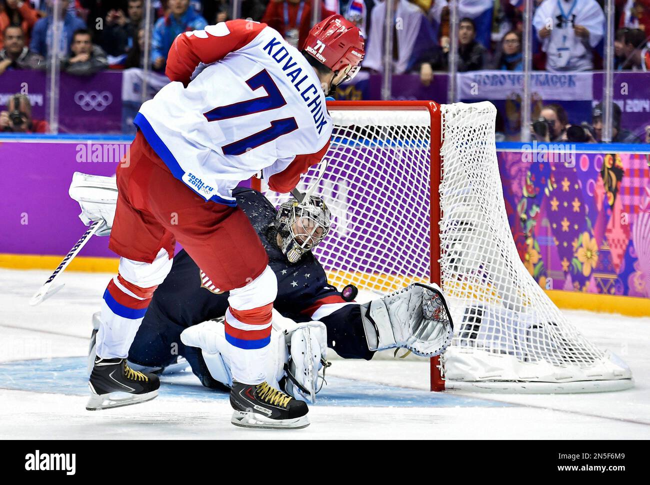 United States goalie Jonathan Quick, right, makes a save against Russia
