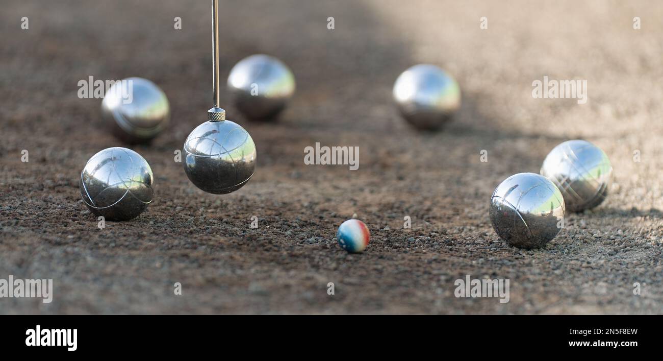 pickup tool for petanque. Petanque balls boules bowls on