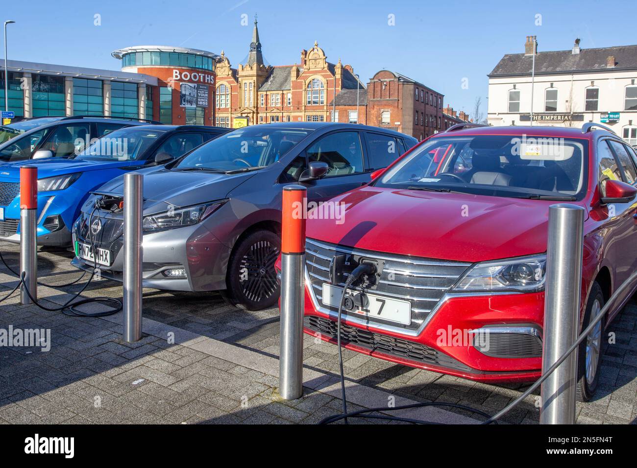 MG 5 Exclusive; Electric Car Charging Point, Flat Iron Shoppers Car Park, Chorley UK Stock Photo