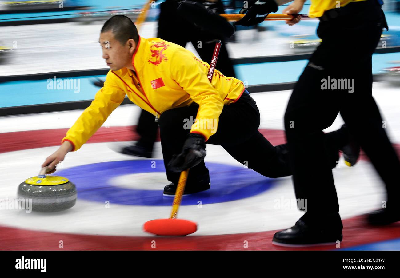Chinas skip Liu Rui delivers a stone during a round robin match between China and Sweden at the mens curling World Championships in the St