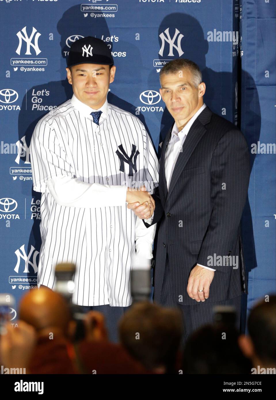 New York Yankees pitcher Masahiro Tanaka, of Japan, poses for