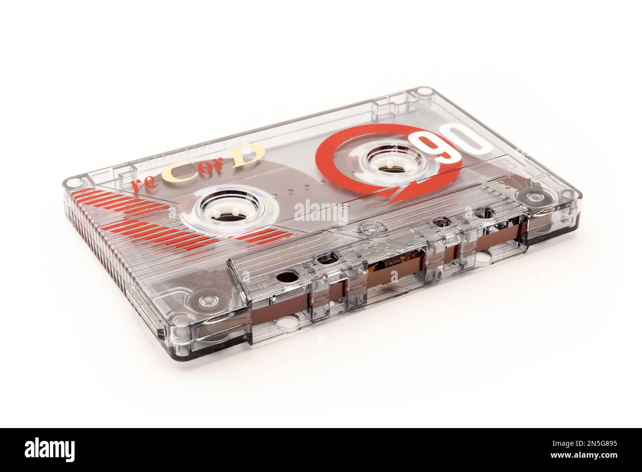 Audio cassette tape - old vintage compact audio cassette on its side isolated on white background, bottom view Stock Photo