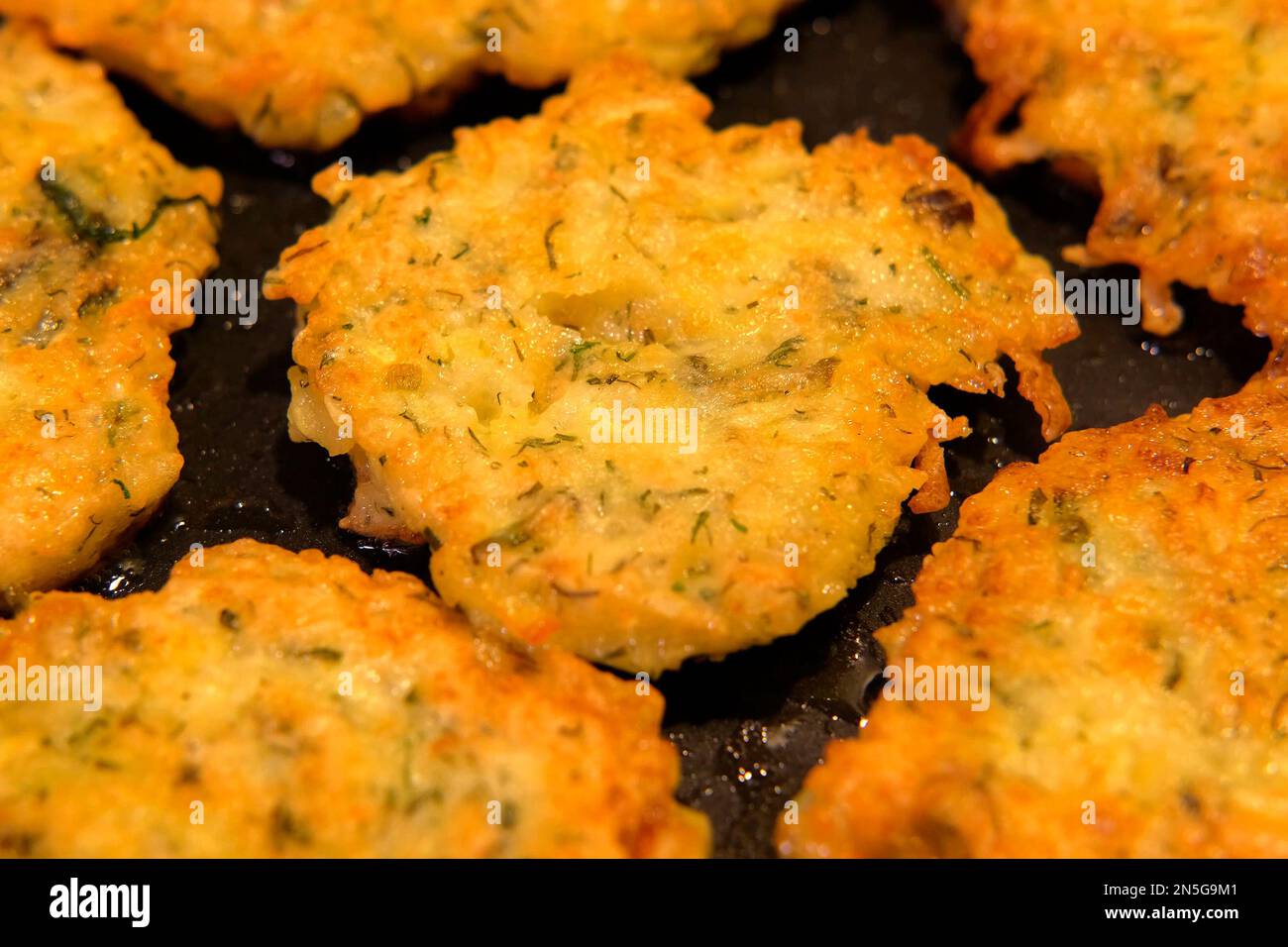 Juicy delicious Homemade Hash browns roasted in castiron skillet. Fried Hash brown Preparing in