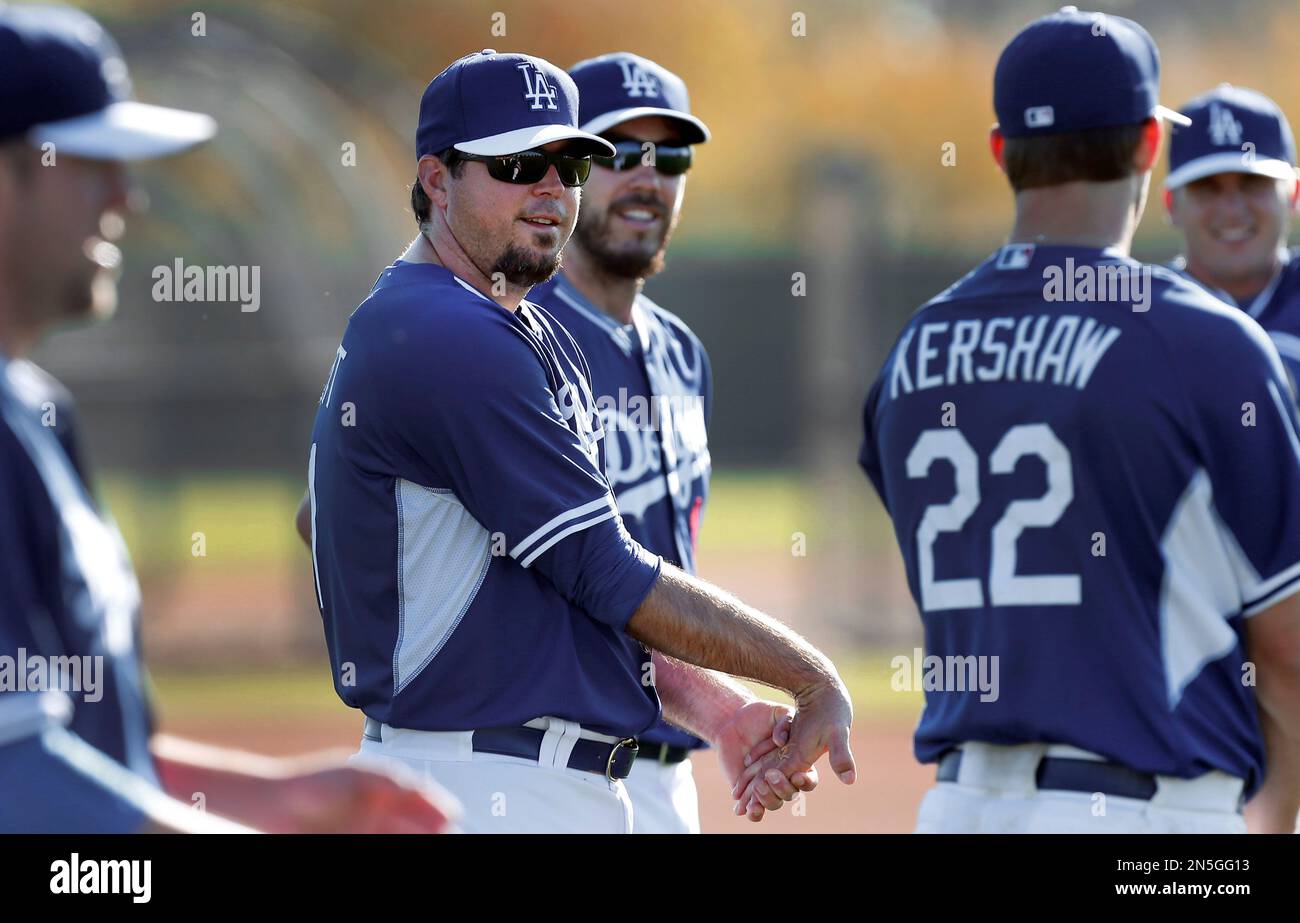 Los Angeles Dodgers pitcher Josh Beckett, center, stretches during