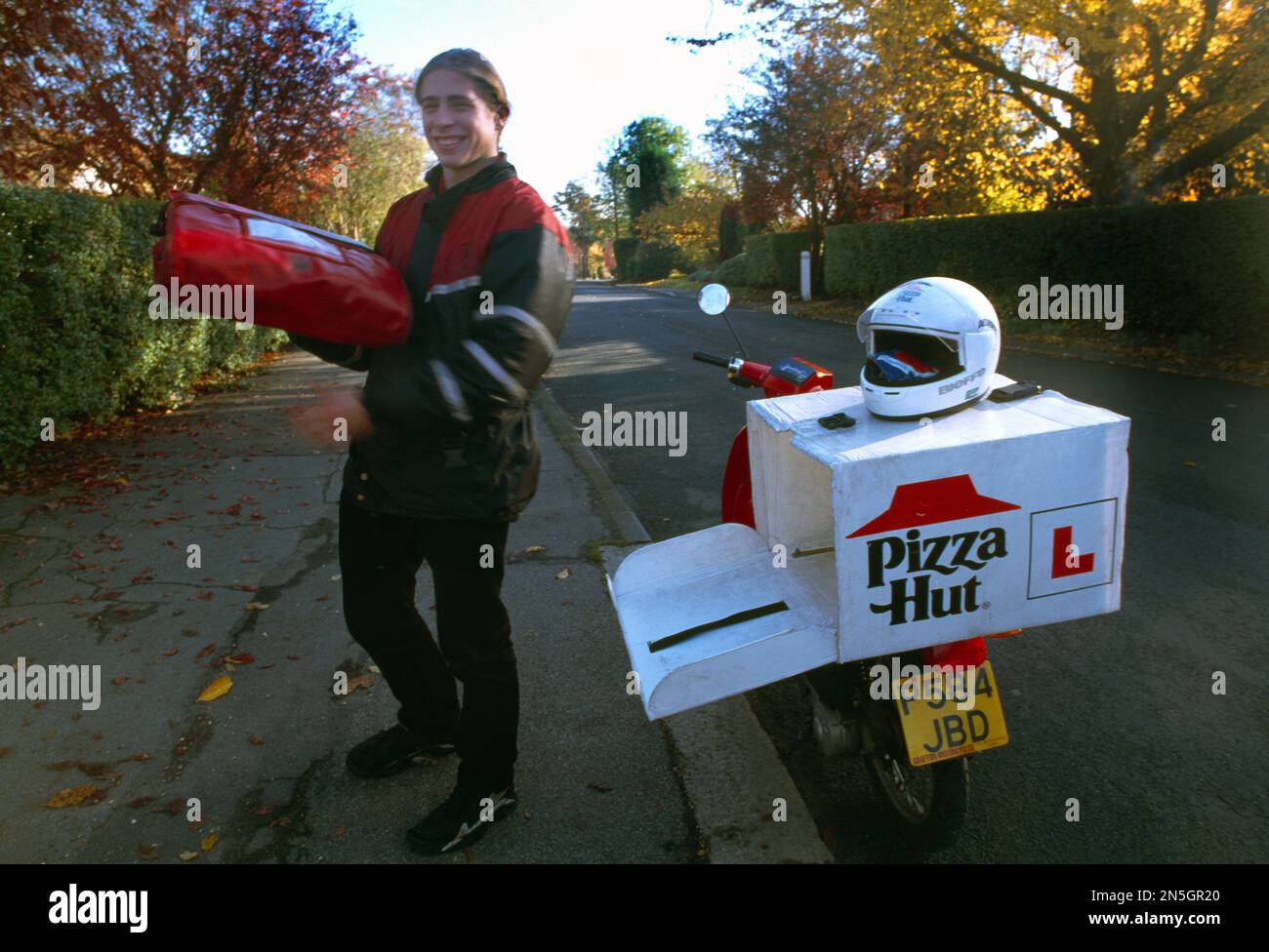 Pizza Hut Delivery Man and Motorbike Surrey England Stock Photo Alamy