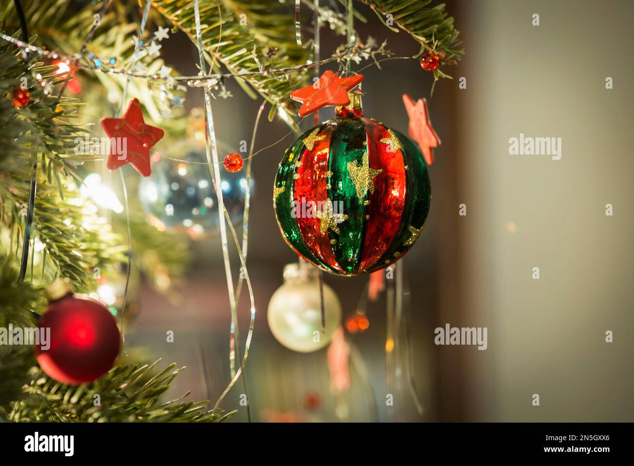 Christmas baubles hanging on Christmas tree, Munich, Germany Stock Photo