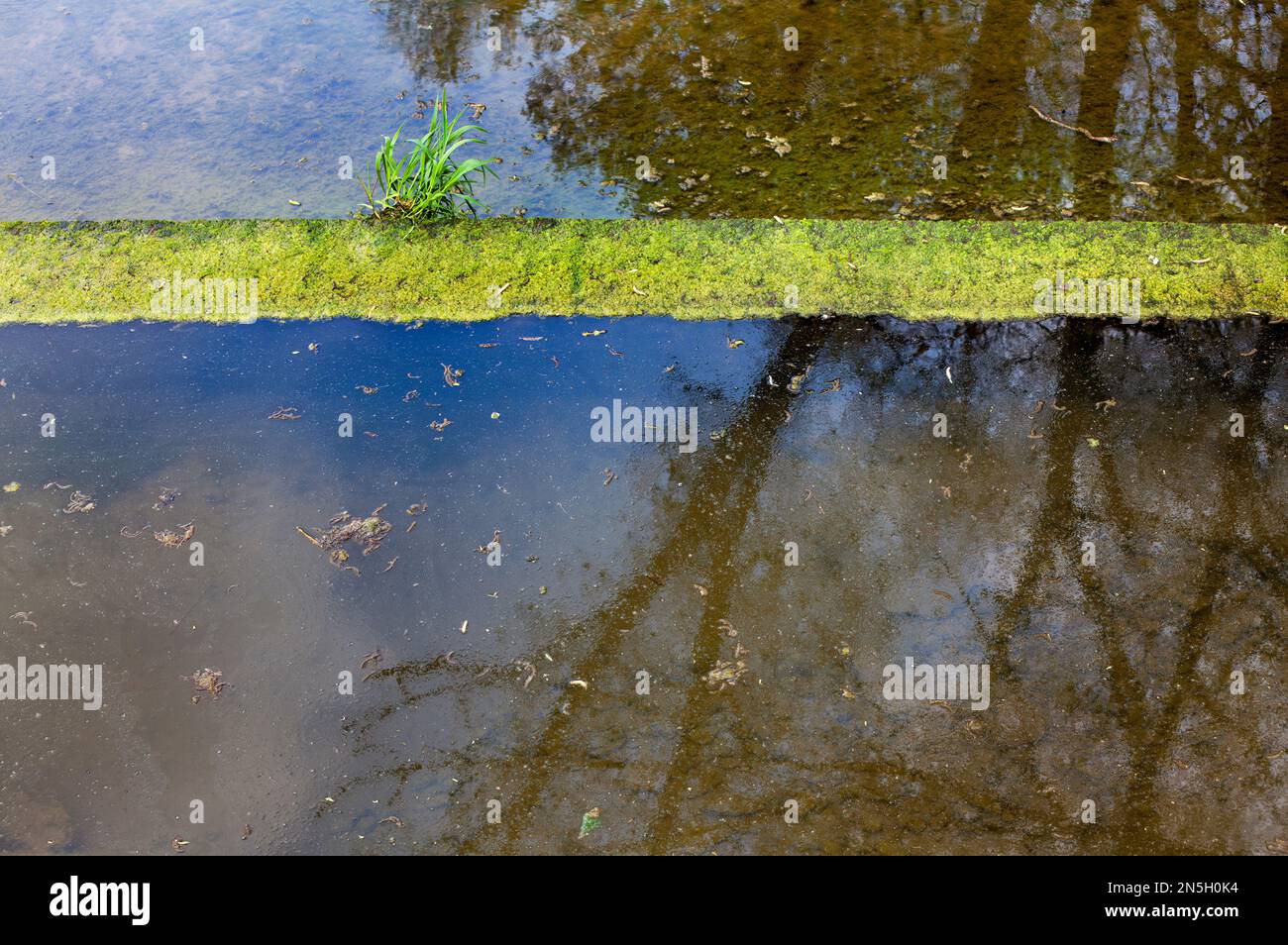 Little dam at a mill race Stock Photo