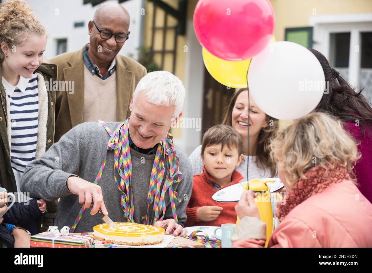 Family celebrating grandfather's birthday, Bavaria, Germany Stock Photo