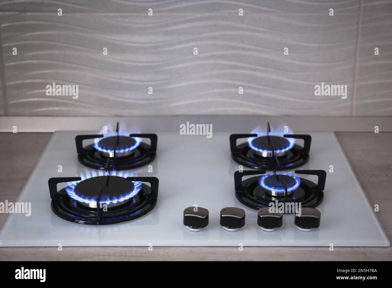 Modern kitchen stove with burning gas indoors Stock Photo Alamy