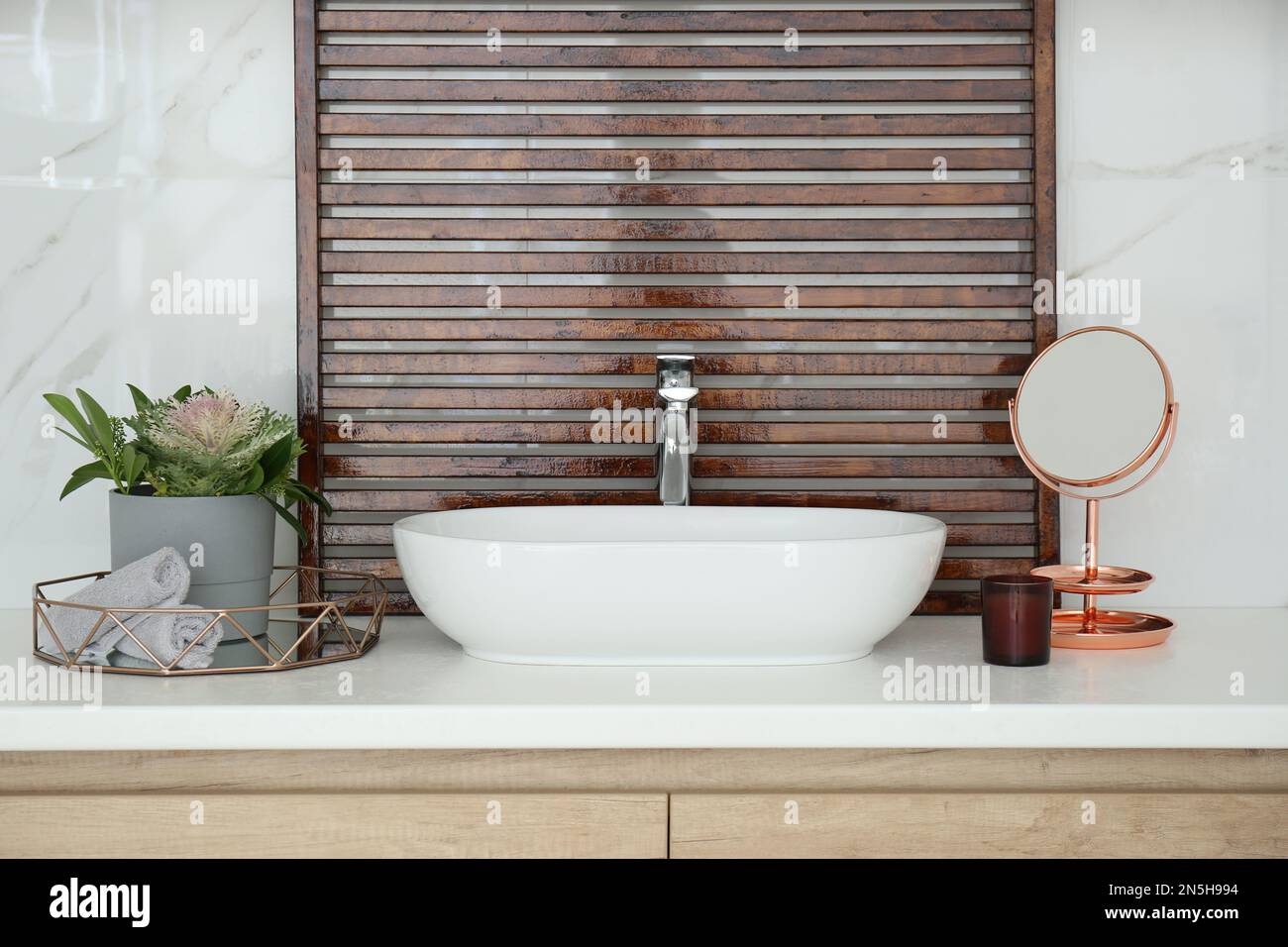 Bathroom counter with stylish vessel sink and small mirror. Interior design Stock Photo - Alamy