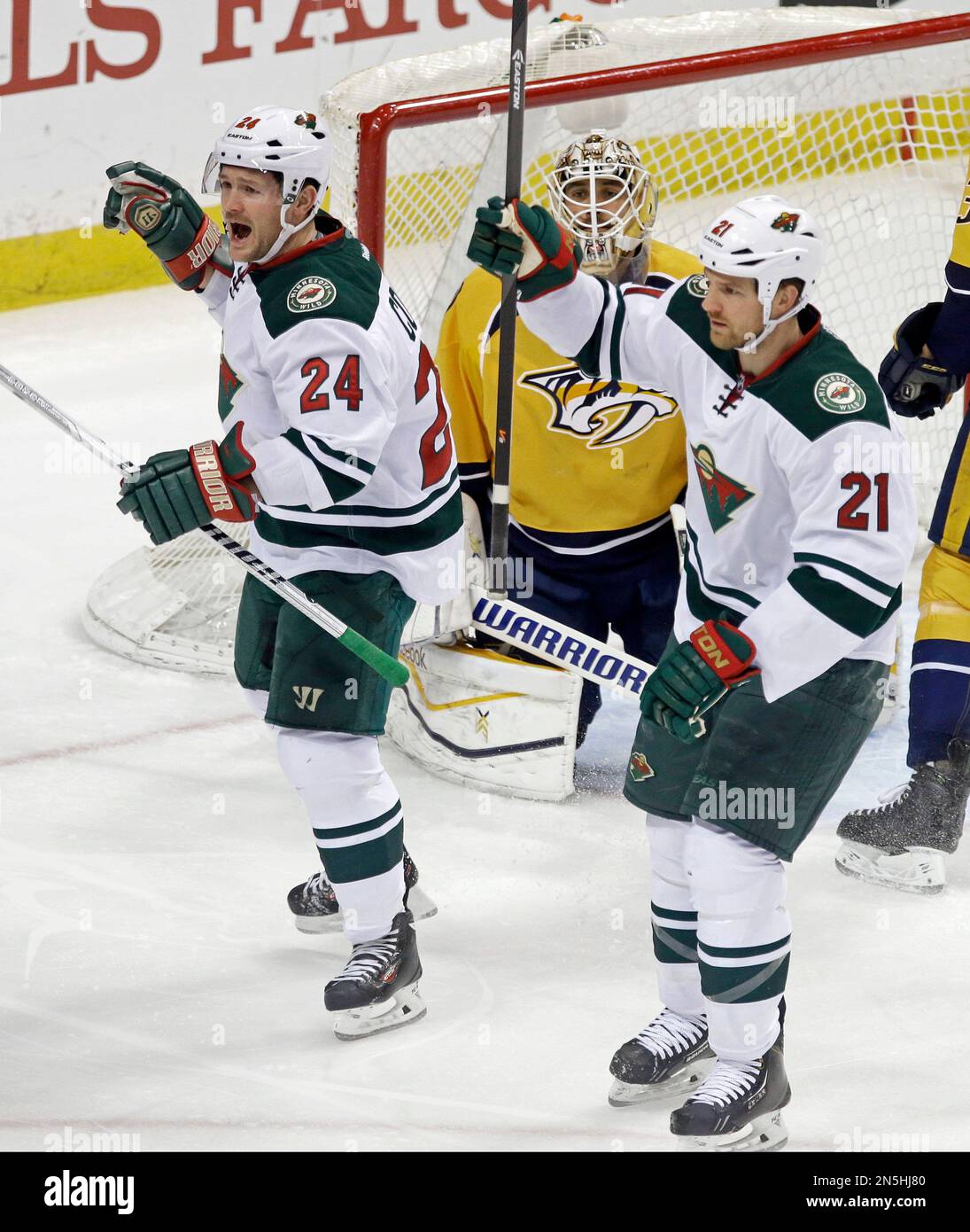 Minnesota Wild's Matt Cooke, left, and Kyle Brodziak, right, celebrate ...