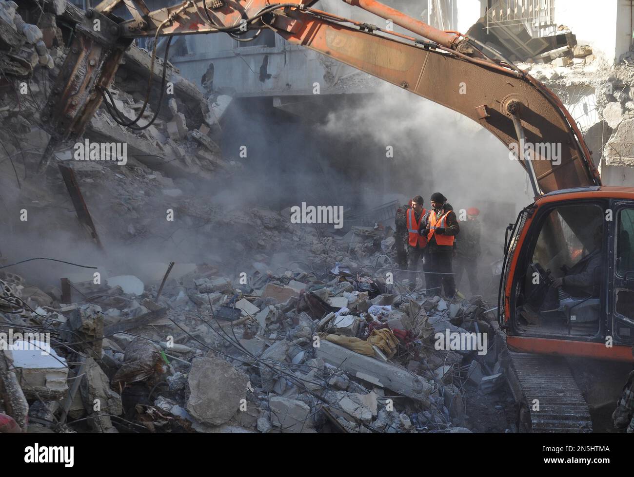 Ankara/Damascus. 9th Feb, 2023. Rescue workers search for survivors among the rubble of a damaged building in the Sulaiman al-Halabi neighborhood in Aleppo city, northern Syria, on Feb. 8, 2023. Credit: Str/Xinhua/Alamy Live News Stock Photo