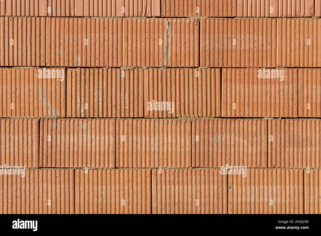 Background with wall made of red bricks Stock Photo