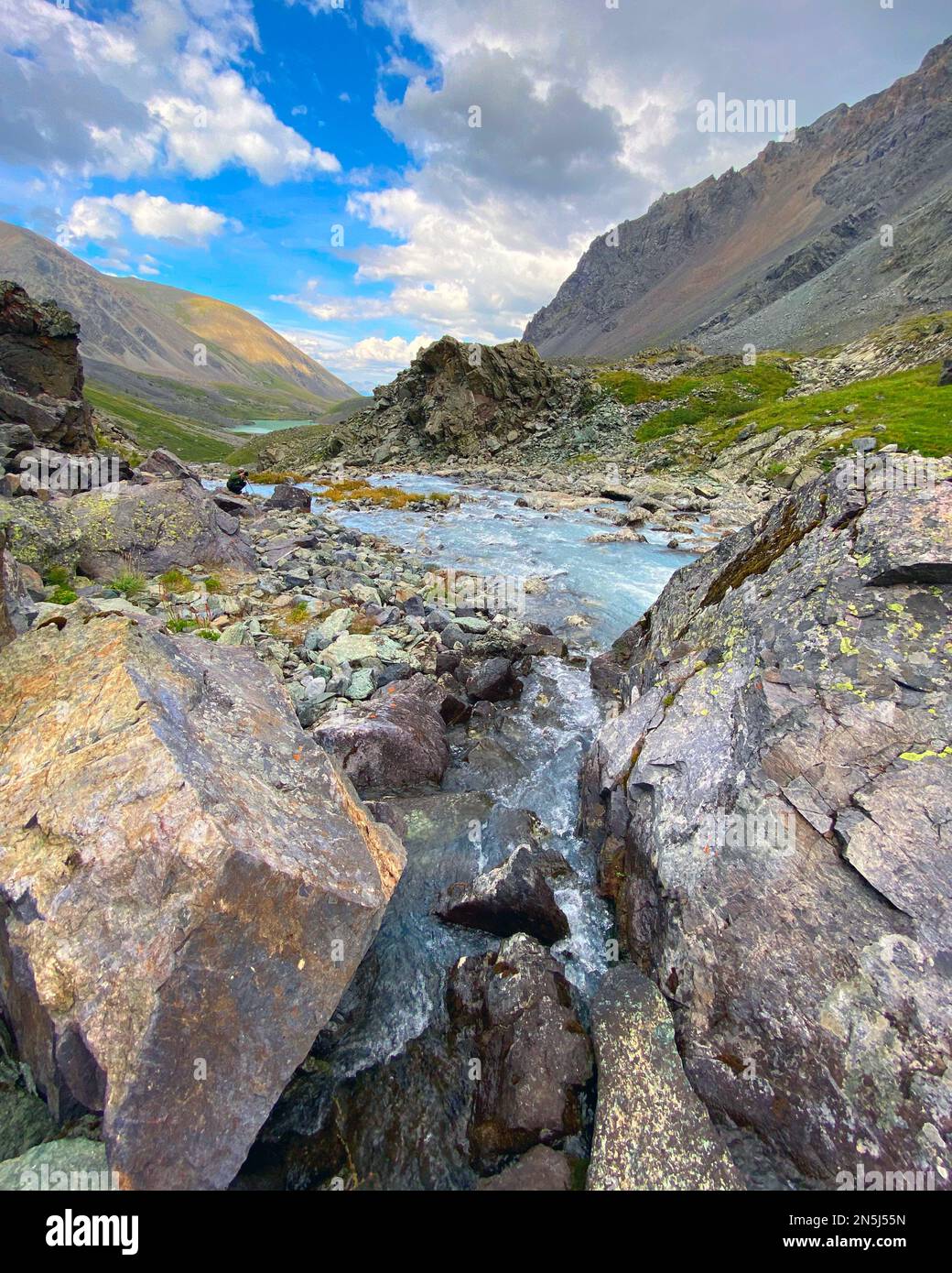 A small mountain river among the stones in the Altai mountains. Stock Photo