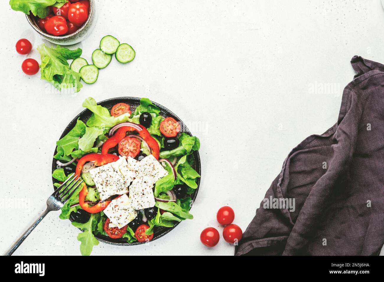 Vegetable greek salad with feta cheese, olives, tomatoes, paprika