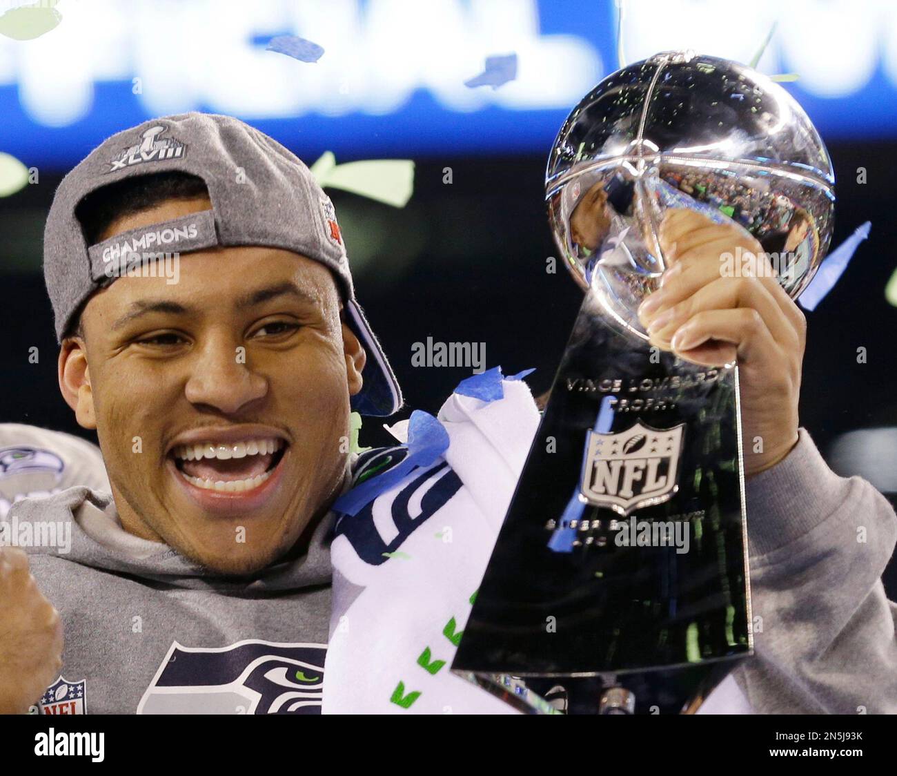 Seattle Seahawks' Malcolm Smith celebrates with the Vince Lombardi