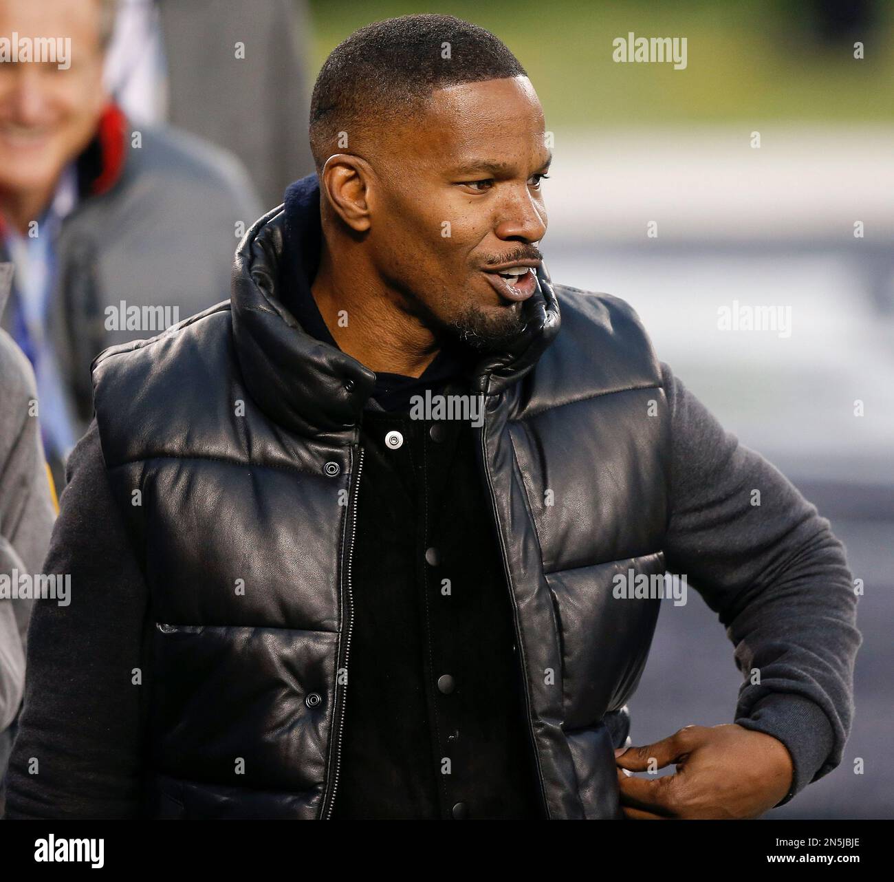 Actor Jamie Foxx walks along the sidelines before the NFL Super Bowl