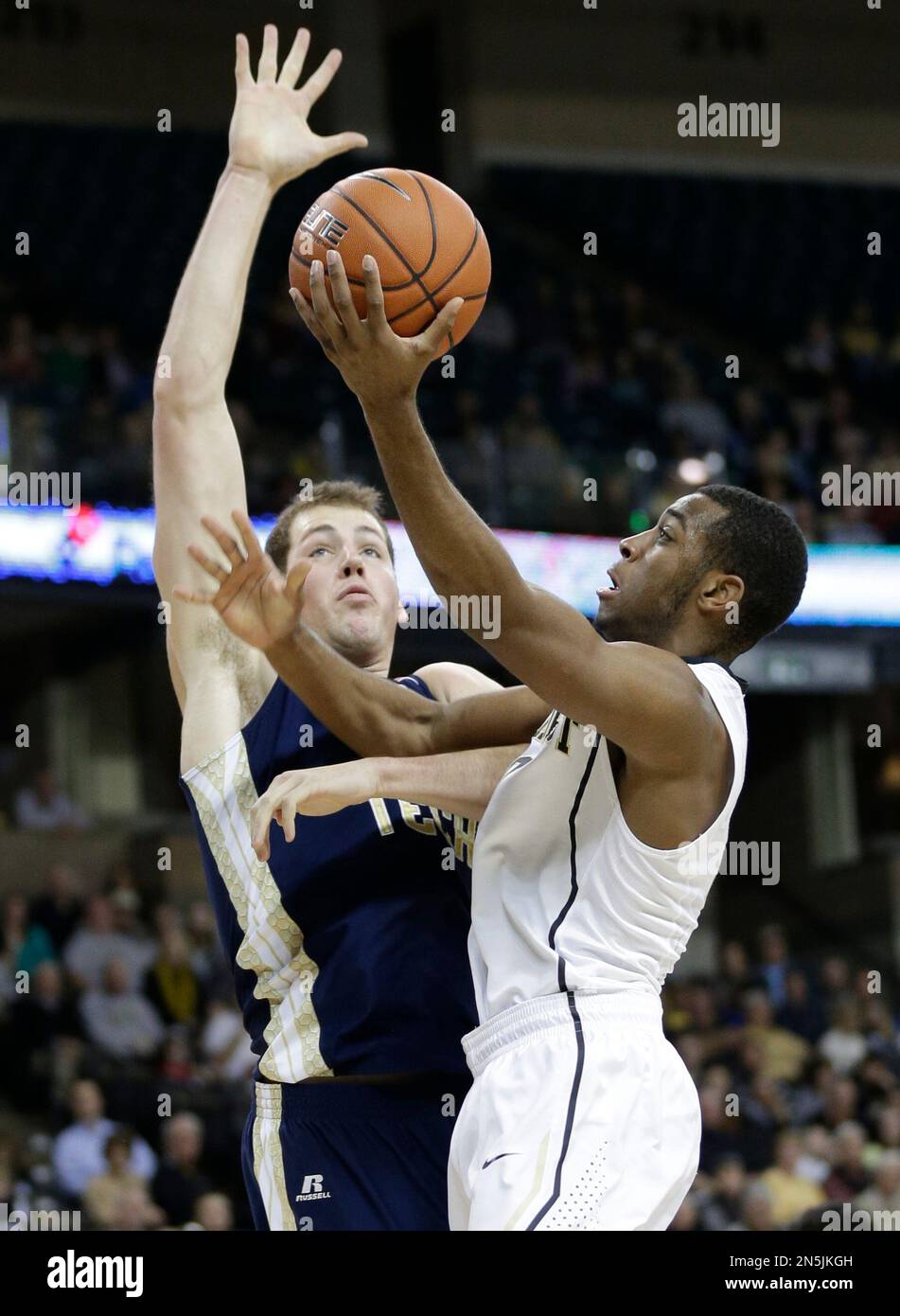Wake Forest's Codi MillerMcIntyre, right, shoots over Tech's