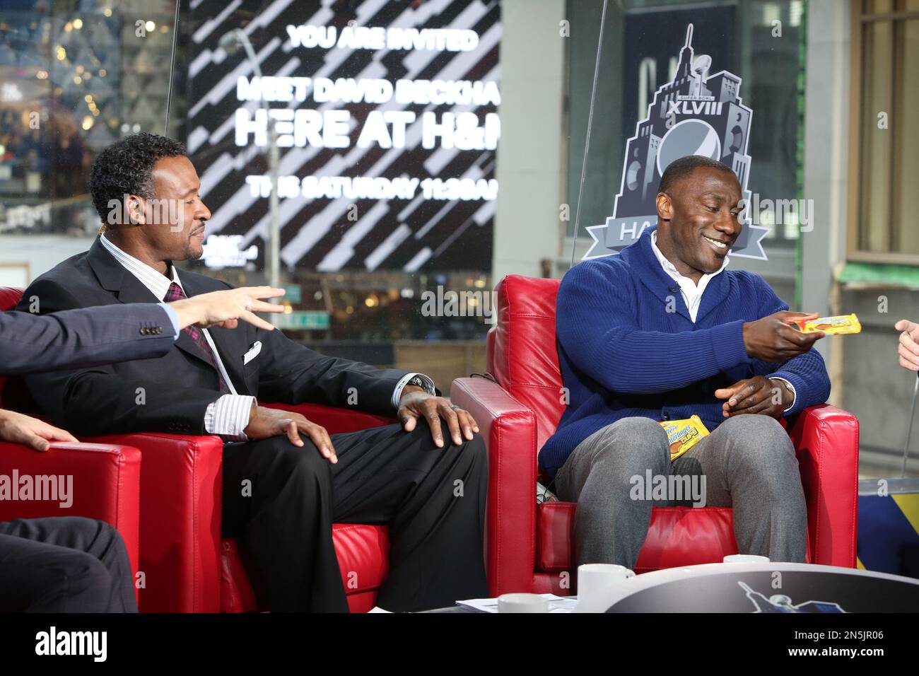 Football legend Shannon Sharpe, right, tells fans why Butterfinger