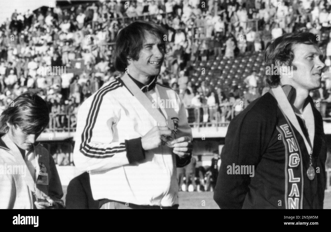 Mike Bull of Northern Ireland, center, smiles after he had been