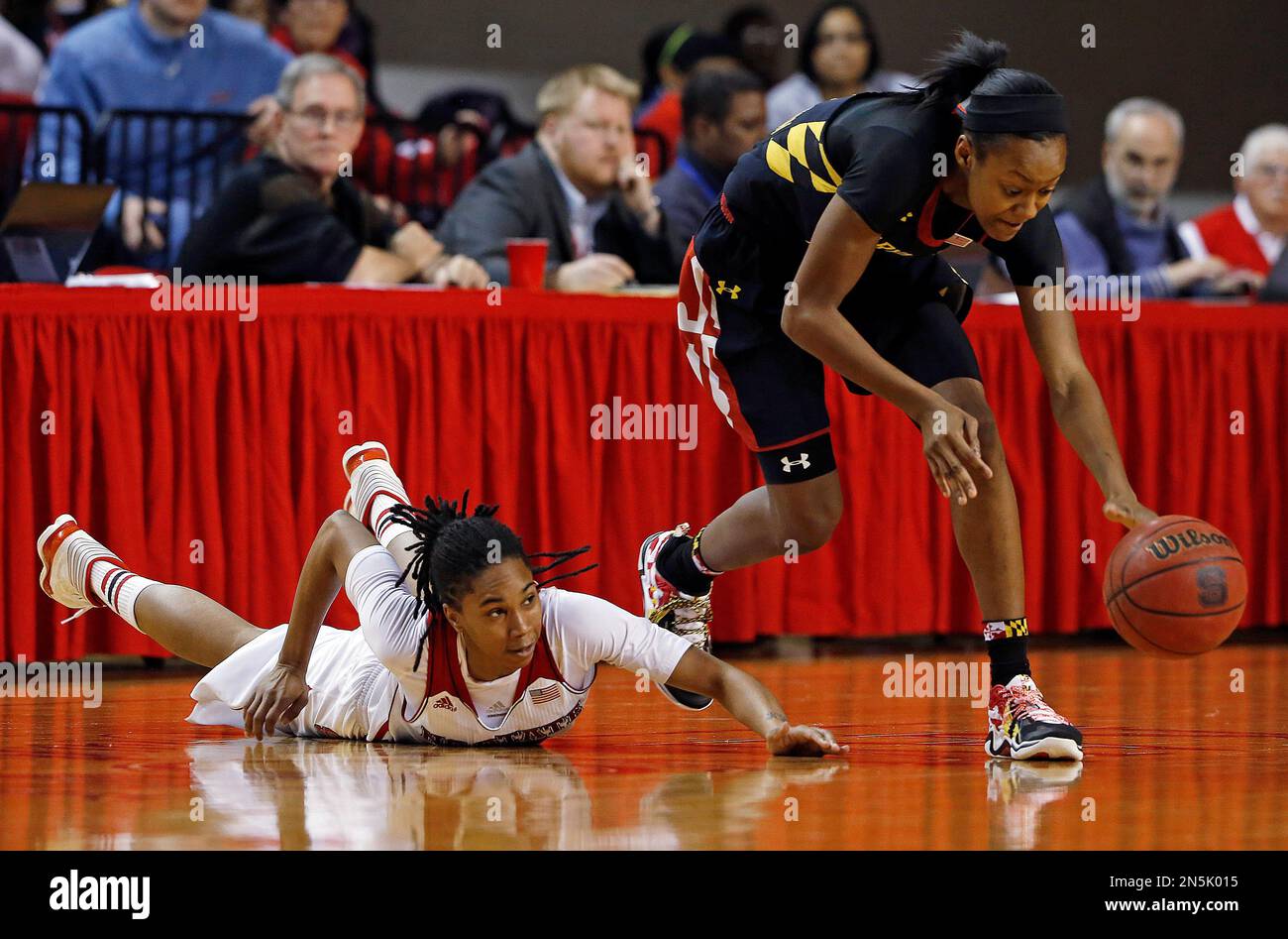 Maryland's Shatori WalkerKimbrough, right, takes the ball away from