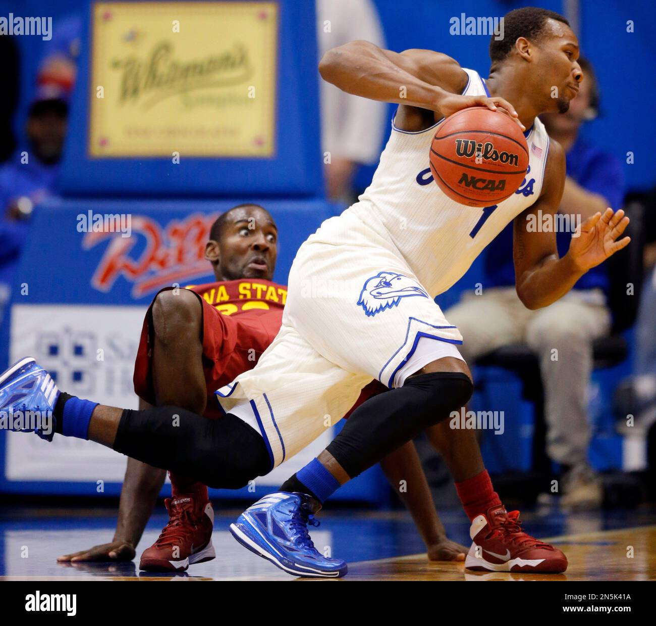 Kansas guard Wayne Selden, Jr. (1) is fouled by Iowa State forward